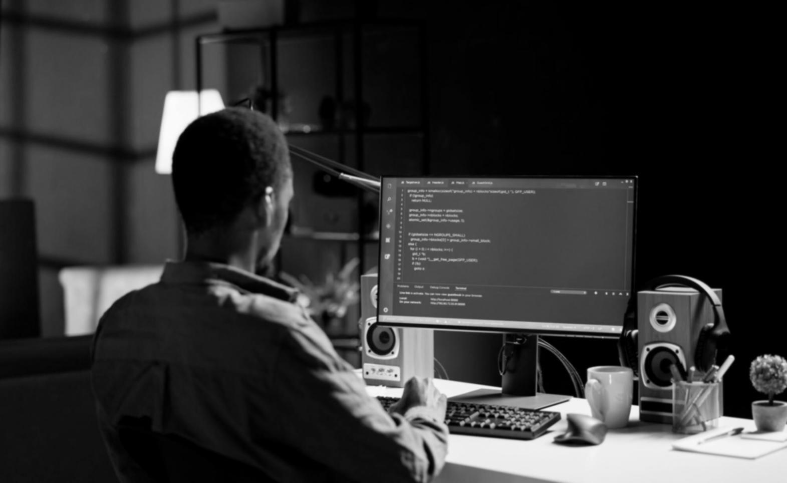 Students working on web design projects with modern development tools